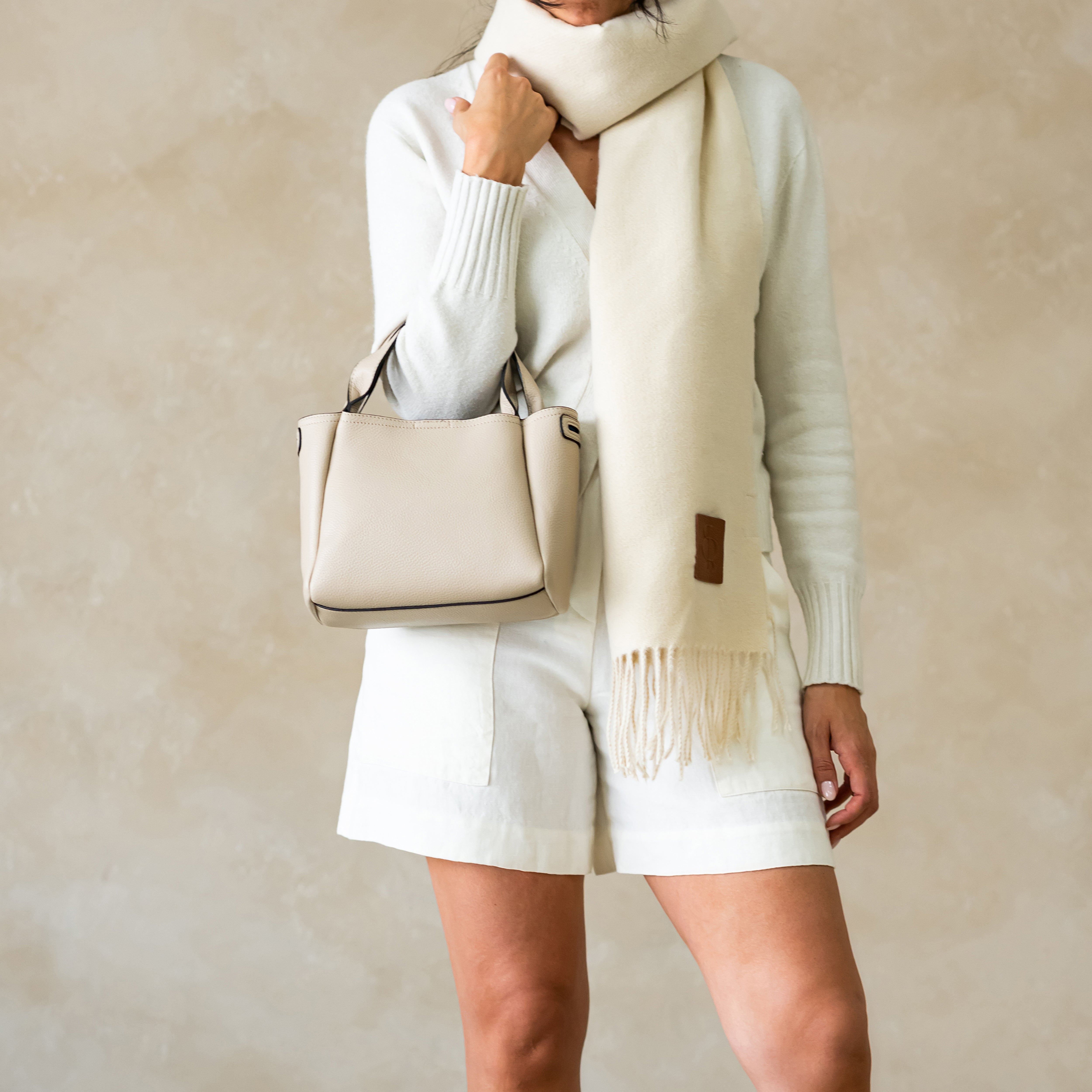 woman wearing Sofia top handle satchel bag
